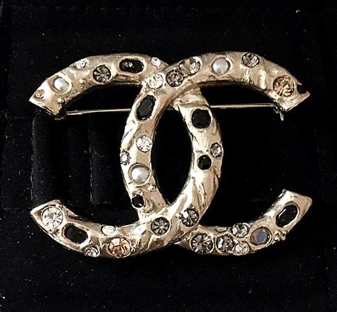 chanel paris in rome brooch